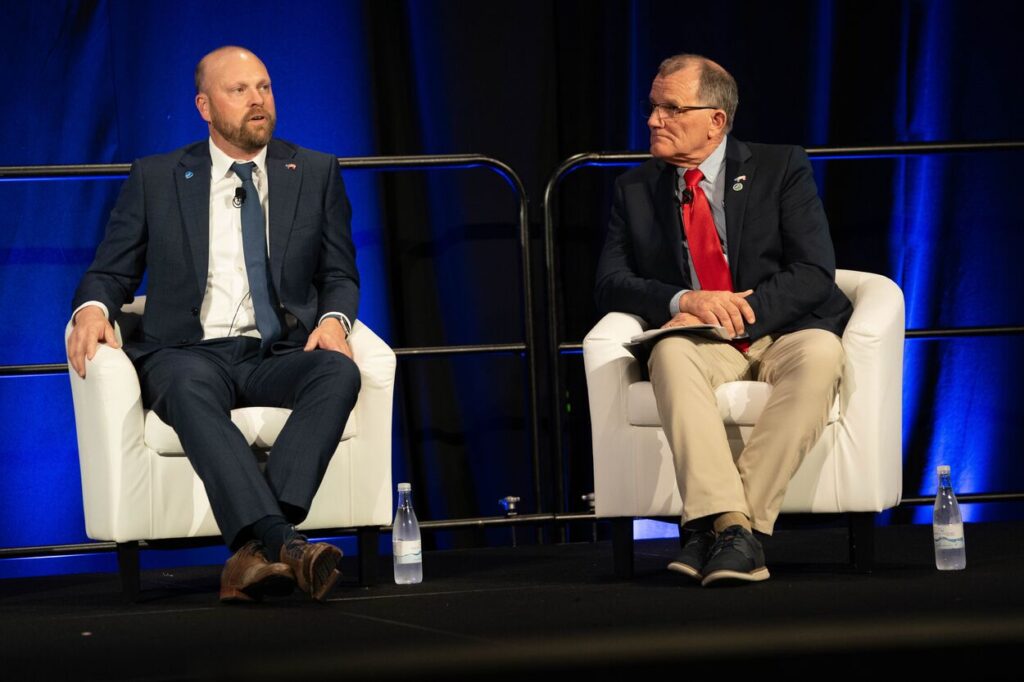 Jesse Heimer and Bill Luckey speaking at Forum